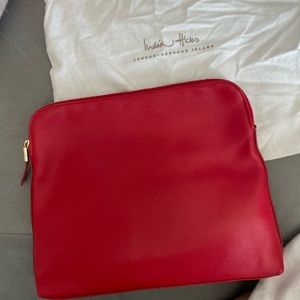 India Hicks red leather clutch